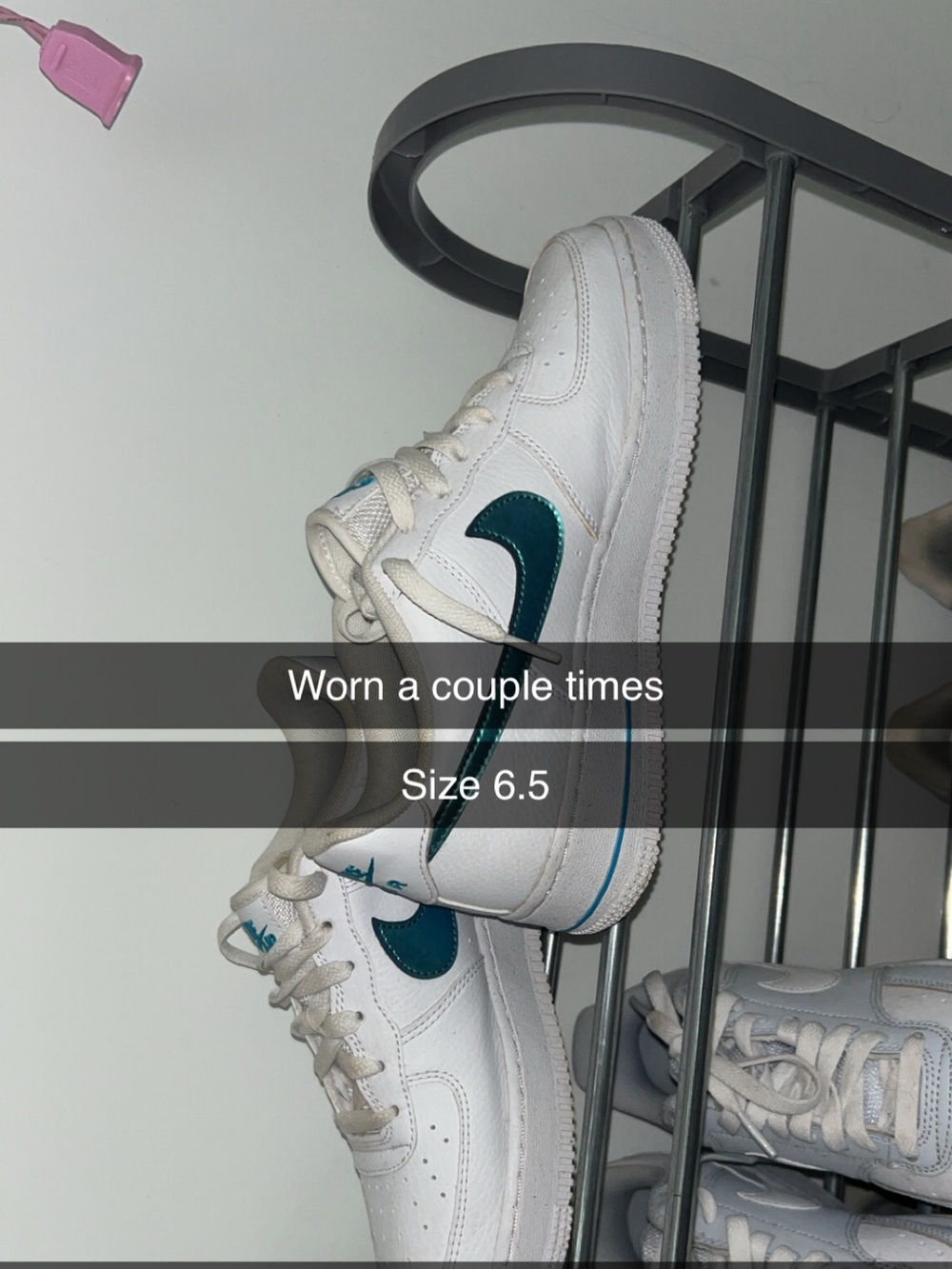White Nike Air Force’s with blue holographic Nike Swoosh